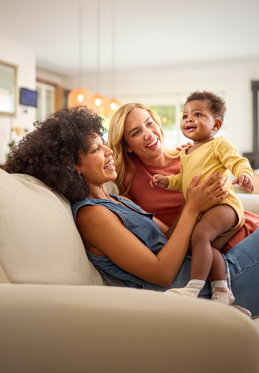 2 women with their child